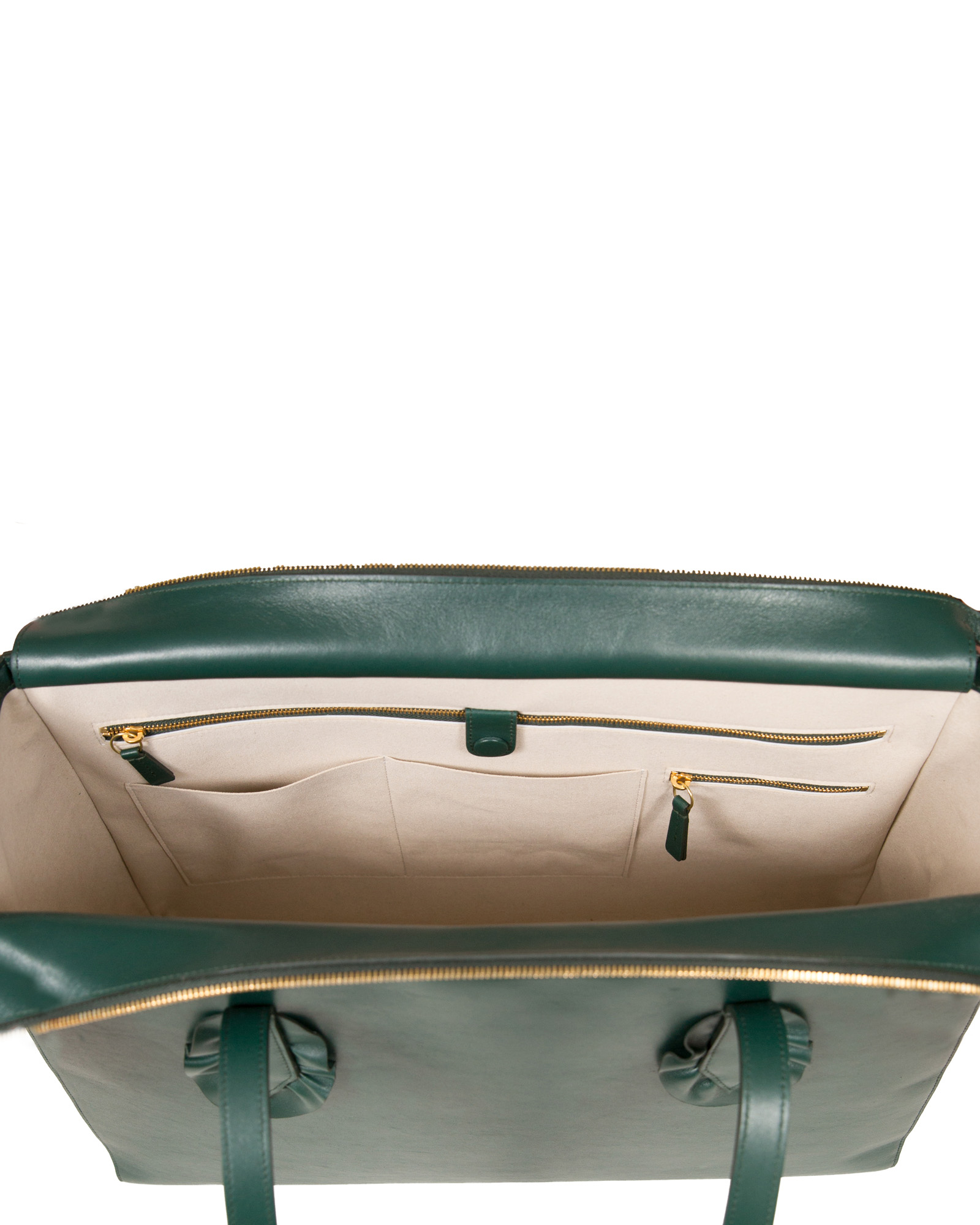 Inside of a JJ Olivier Italian leather tote in green.